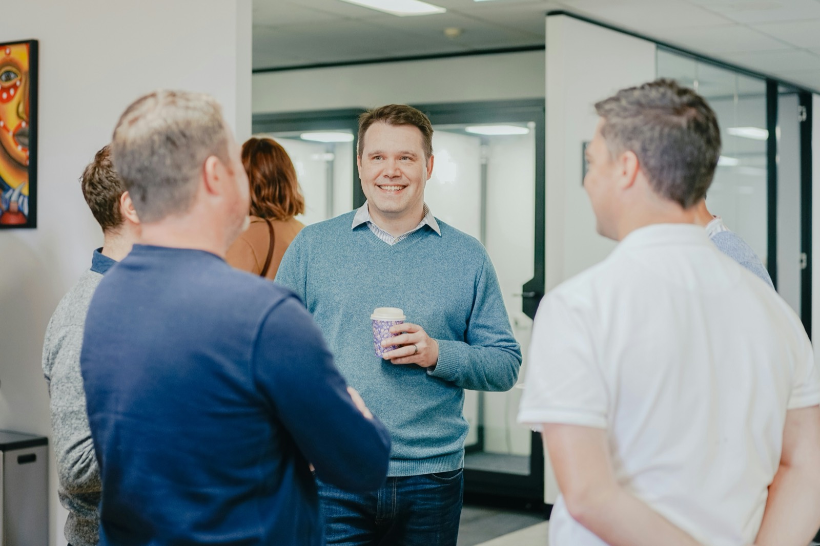 A team talking over coffee